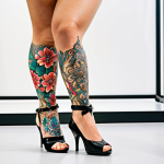 **

A confident Italian woman with a stylish, personalized bionic leg prosthesis. The prosthesis is decorated with vibrant floral patterns inspired by her own tattoos. She is smiling radiantly at a prosthetics event, conveying self-acceptance and empowerment. The background is a modern, well-lit exhibition space.

**